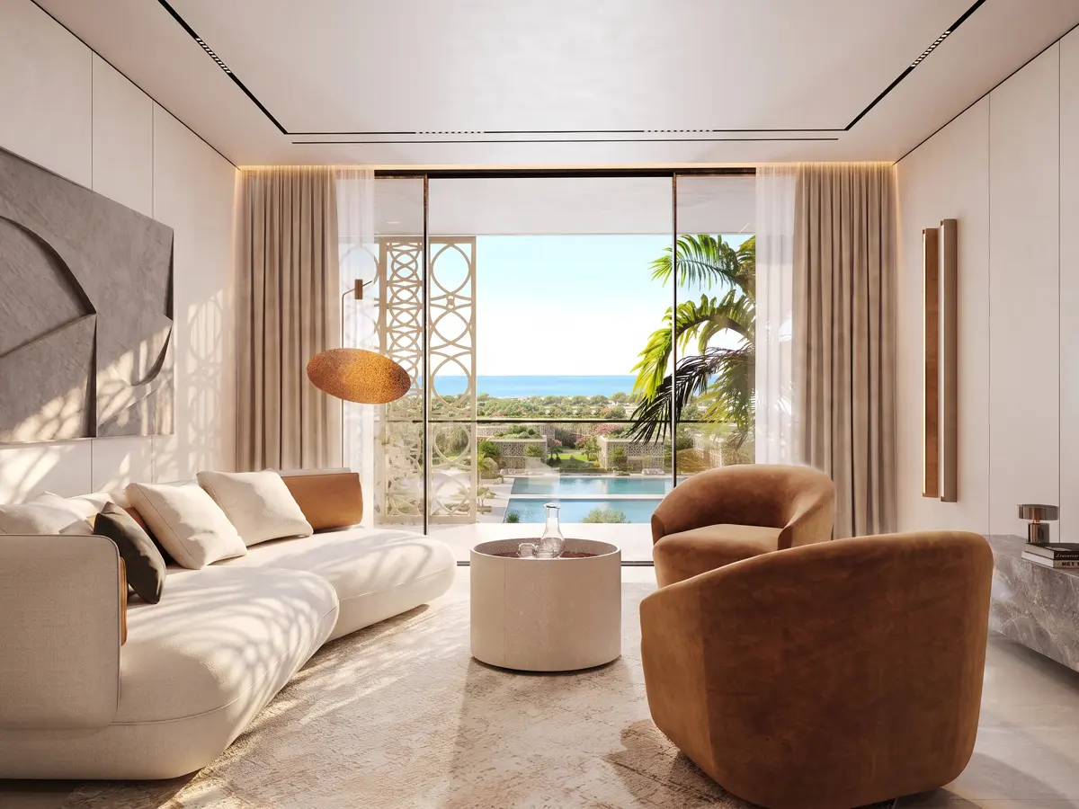 Branded living room opening onto the pool terrace and the sea
