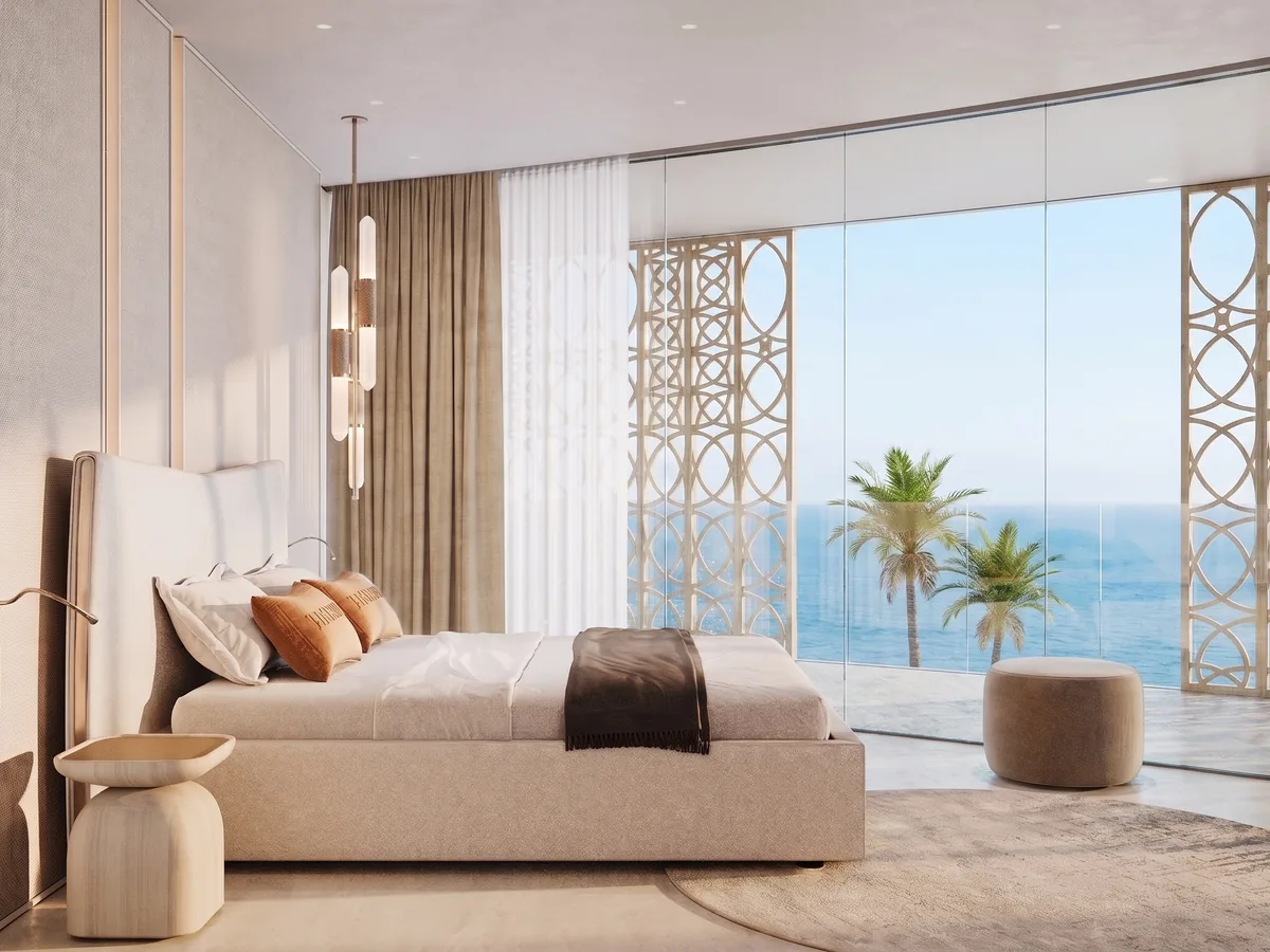 Bedroom opening onto a terrace above the sea