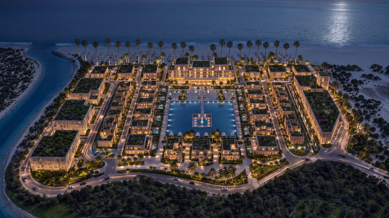 The community lit at night around the central pool
